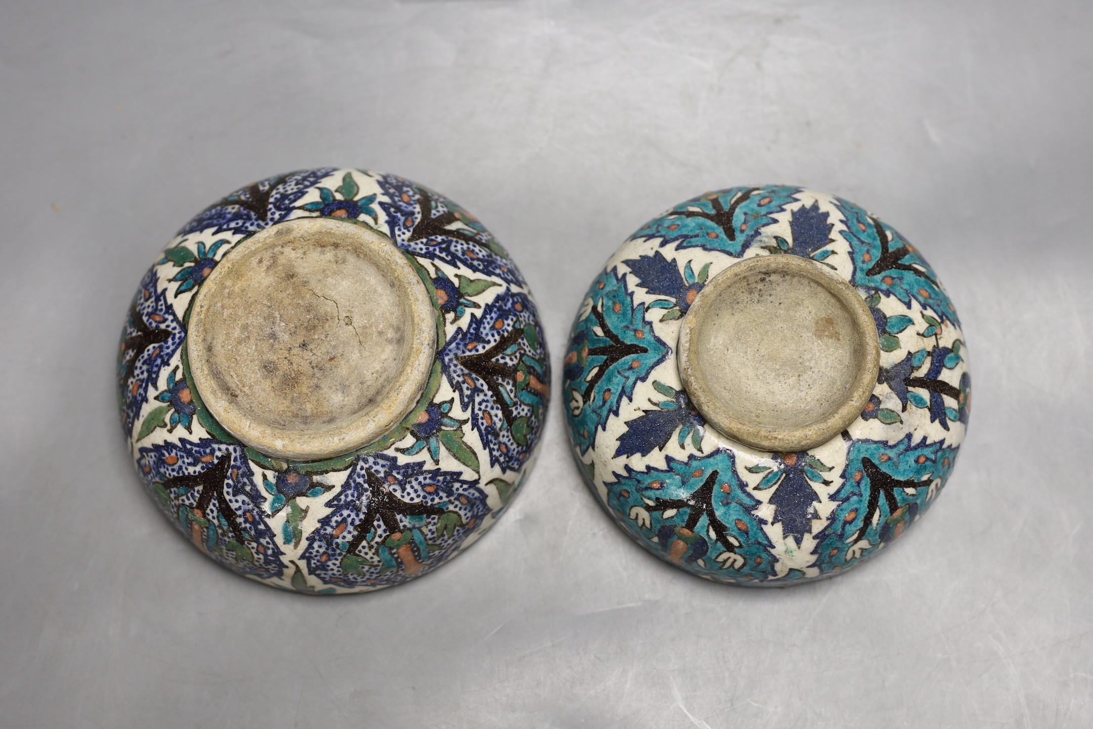 Two Iznik style fritware footed bowls, 15.5 cms diameter.